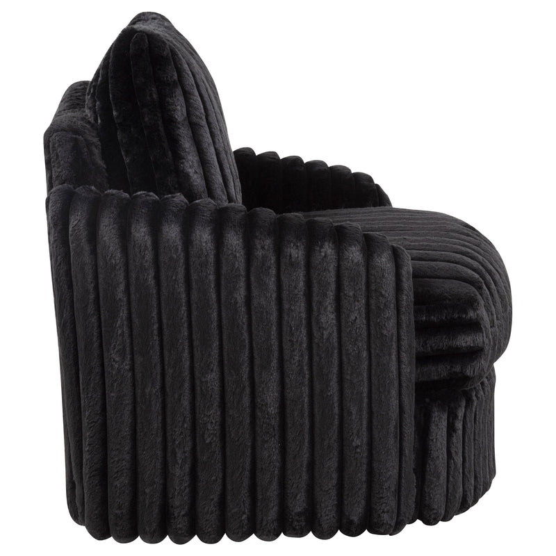 Sillón tapizado de pana Sarco con giro.