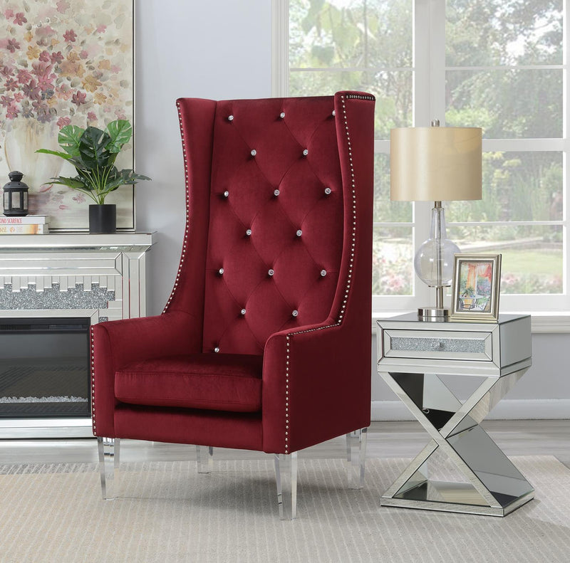 Sillón con respaldo alto, tapizado en terciopelo negro y patas de acrílico